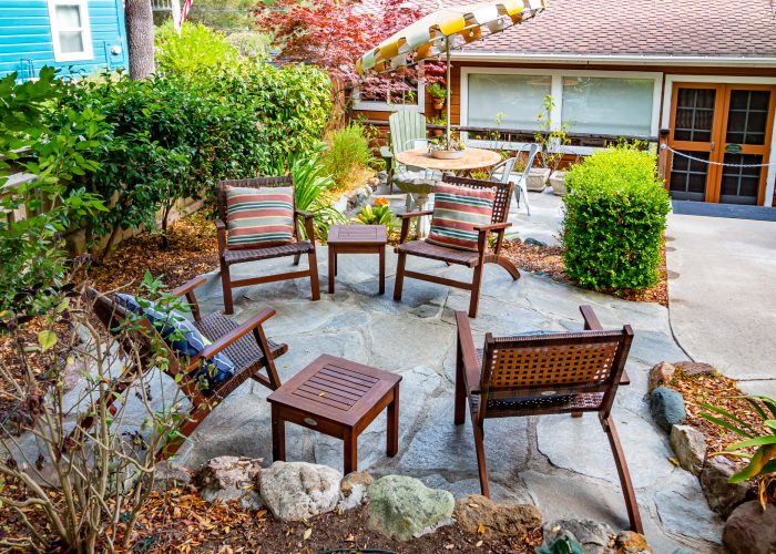 Overview of patio area with woven lounge chairs